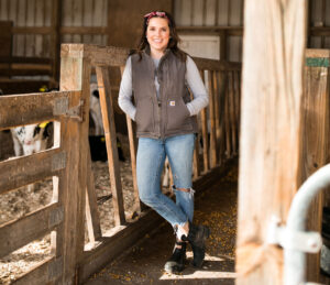 Annaliese Wegner in heifer barn - modern day farm chick